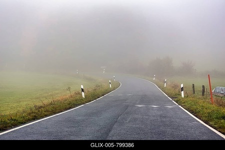 Curvy road to Köterberg, speed limit markings on roadway, shark's teeth, dreary autumn weather with fog, Lügde, Weserbergland, North Rhine-Westphalia, Germany-stock-foto