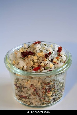 Colourful sea salt, mixture with chili, paprika, oregano, basil, garlic, onions and pepper-stock-foto