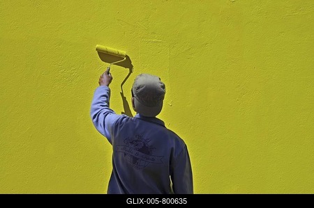 Painter painting a yellow wall in Bo-Kaap the traditional muslim city district of Cape Town, South Africa, Africa-stock-foto