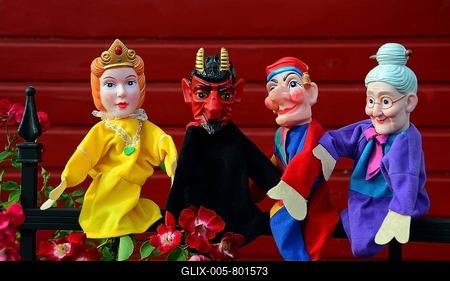 Punch puppets, Punch, Princess, Grandmother and Devil sitting on a metal fence-stock-foto