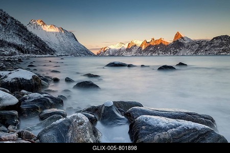 Norwegian fjord, snow-covered mountains at sunset, near Mefjordv誡, Senja Island, Norway-stock-foto