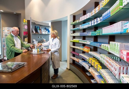 Pharmacy, Pharmacist advises a customer picking up a medicine on prescription, Germany-stock-foto