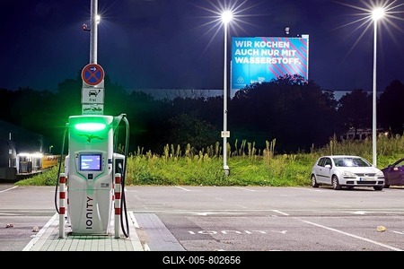 Charging station and large poster Climate steel at the ThyssenKrupp Steel Bochum plant, Ruhr area, North Rhine-Westphalia, Germany-stock-foto
