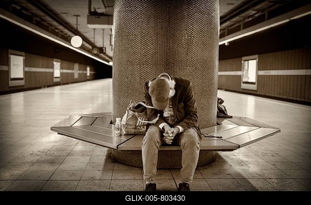 Homeless person, Berber, sitting in the waiting area of a suburban railway station, Stuttgart, Baden-Württemberg, Germany-stock-foto