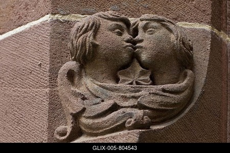 Medieval sandstone relief of a kissing couple, Freiburg, Baden-Wuerttemberg, Germany, Europe-stock-foto
