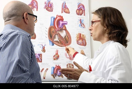 Medical practice, doctor explaining operation and possible diseases of the human heart to a patient-stock-foto