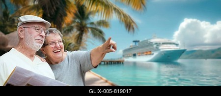 Senior adult couple enjoying the view from the dock with passenger cruise ship in the background-stock-foto