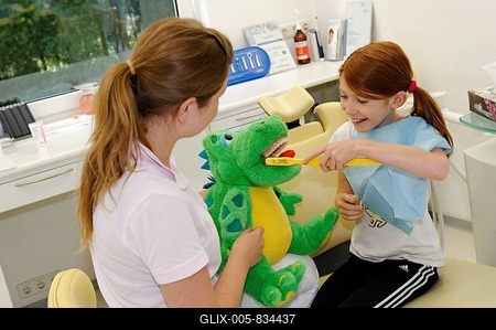 Girl at the dentist's, receiving instructions for dental care on a model, dental hygiene, dental care, dental visit-stock-foto