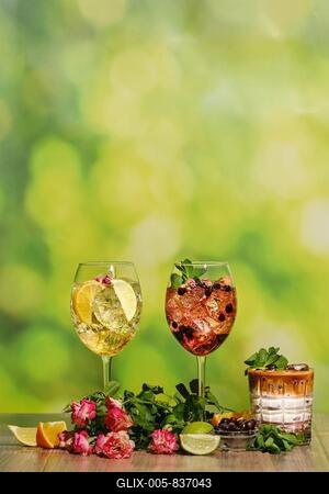 Set of cold sangria in a wine glass and iced coffee summer drinks on wooden table with ingredients-stock-foto
