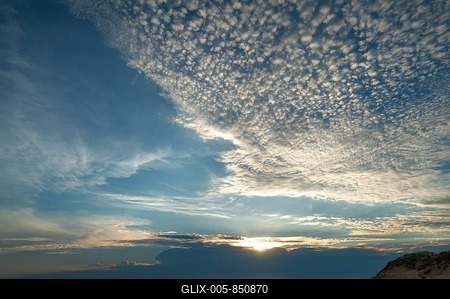 Sunset with small cirrocumulus clouds, herringbone sky, by the Atlantic coast, La Tranche sur Mer Vandee, France-stock-foto