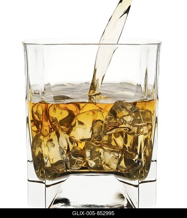 Pouring whisky into a glass-stock-foto