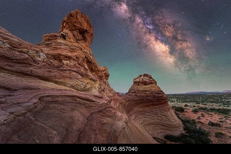 A breathtaking view of the Milky Way illuminating the night sky over unique desert rock formations in Coyote Buttes, showcasing the beauty of nature and the cosmos in perfect harmony-stock-foto