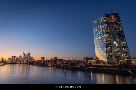 The lights of the European Central Bank (ECB) and the Frankfurt banking skyline glow in the evening, Frankfurt am Main, Hesse, Germany-stock-foto