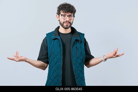 Confused man spreading hands bewildered isolated. Unsure person with face worried-stock-foto