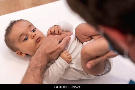 High angle view and close-up of a cute baby during an examination with the doctor-stock-foto