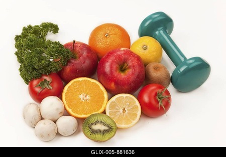 Fruit and vegetables with a dumbbell-stock-foto