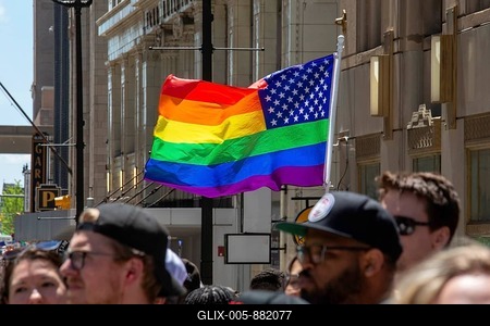 Detroit, Michigan USA, 9 June 2024, Gay, lesbian, bisexual, and transgender activists and their allies marched for equality in the Motor City Pride parade. A stars and stripes pride flag flew near the parade-stock-foto