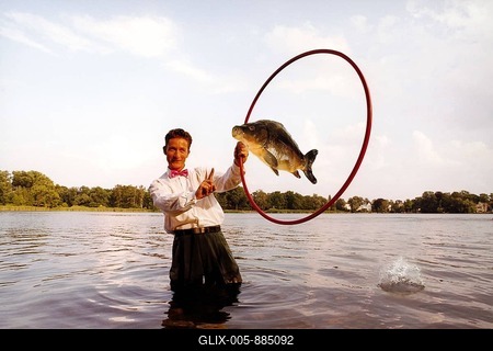 Acrobat, dressage, carp, lake, fish jumps through a hoop, Berlin Germany-stock-foto