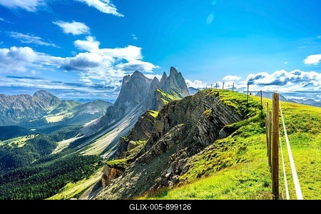 Majestic peaks of seceda rise above lush green valleys and meadows in the italian dolomites, a breathtaking summer vista-stock-foto