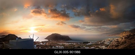 Sweeping panoramic view of the coastal landscape from the town of Arkasa and windmill at sunset, Arkasa, Karpathos, Greece-stock-foto