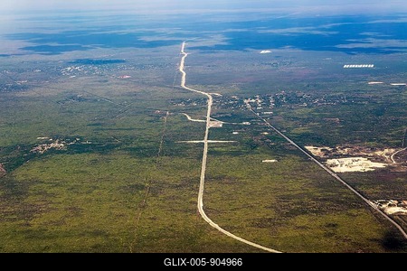 Oblique angle aerial view plane window over new railway tracks of Train Maya, Tren Maya, crossing countryside near Merida, Yucatan, Mexico-stock-foto