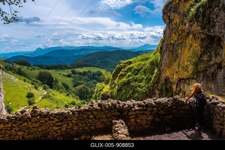 A young woman in the cave of San Adrian. Mount Aizkorri 1523 meters, the highest in Guipuzcoa. Basque Country. Ascent through San Adrian and return through the Oltza fields-stock-foto
