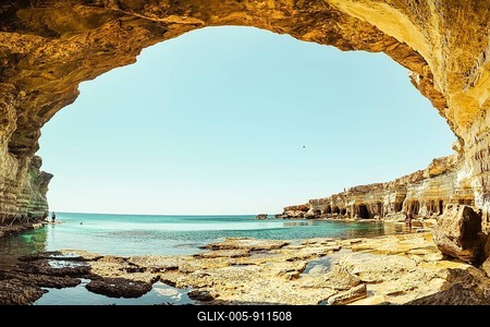 Sea cave arch viewpoint near Cape Greko, Capo Greco, Ayia Napa and Protaras on Cyprus island, Mediterranean Sea. Breathtaking seascape. Turquoise crystal clear waters in sunny day-stock-foto