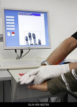Fingerprints and handprints being recorded by digital scanner, physical identification of a suspect in a criminal investigation by the Criminal Investigation Department, re-enacted scene-stock-foto