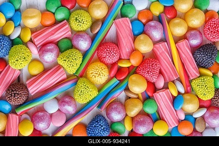 Mixed multicolored candies on white wooden background. top view, flat lay-stock-foto