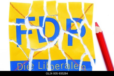 Torn logo of the FDP, German Free Democratic Party, symbolic image for party losing votes, Germany-stock-foto