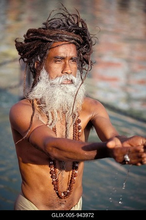 Sadhu holy man, morning prayer in the Ganges, Puja, Kumbha Mela, Har Ki Pauri Ghat, a famous bathing ghat at Haridwar or Hardwar, Uttarakhand, formerly Uttaranchal, North India, India, Asia-stock-foto