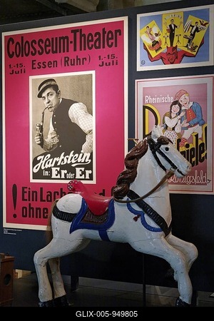 Historic poster of the Colosseum Theater Essen and a carousel horse, New Ruhr Museum, Zollverein Coal Mine Industrial Complex, Essen, North Rhine-Westphalia, Germany, Europe-stock-foto