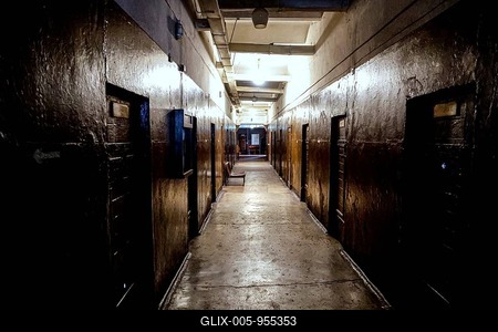 Dark corridor of the Karosta prison in Liepaja with visible cell doors, Liepaja, Courland, Latvia-stock-foto