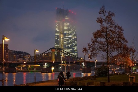 Low clouds envelop the illuminated European Central Bank (ECB) in Frankfurt am Main in the evening. Frankfurt am Main, Mainufer, Hesse, Germany-stock-foto