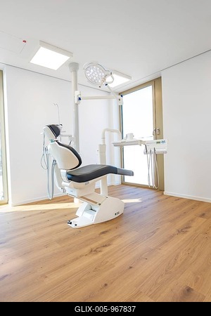 Bright dental practice with a modern dental chair and wooden floor, dentist, medical center at the Calw health campus, Germany-stock-foto