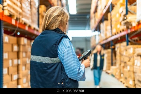 Rear view of an unrecognizable woman using scanner working in a distribution warehouse-stock-foto