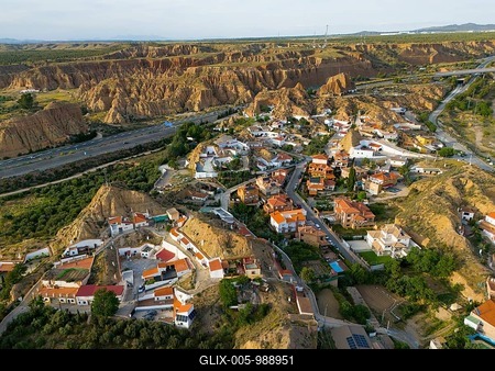 Aerial view of a village in a hilly landscape with traditional houses and rugged rocks, aerial view, cave hotel, Cuevas Pedro Antonio de Alarcon, Guadix, Granada, Andalusia, Spain-stock-foto
