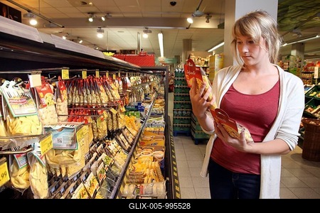 Customer, woman standing in front of the refrigerated counter with fresh pasta, pasta products, food hall, supermarket, Germany, Europe-stock-foto