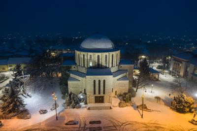 Churc in Mohacs main squere with snow-stock-photo