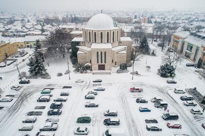 Churc in Mohacs main squere with snow-stock-photo