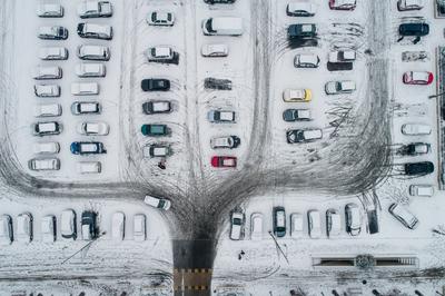 rows of parked cars covered with snow-stock-photo