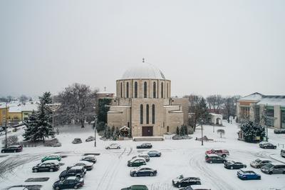 Churc in Mohacs main squere with snow-stock-photo