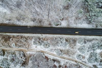 road with snowy forest in Hungary-stock-photo