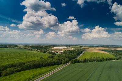 Garbage trucks unload garbage to a landfill, drone photo-stock-photo