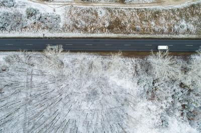 road with snowy forest in Hungary-stock-photo