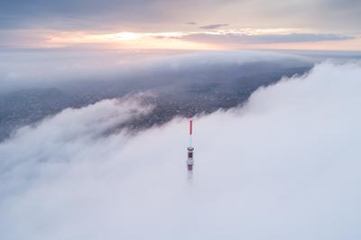 TV tower with cloudy and foggy sky-stock-foto