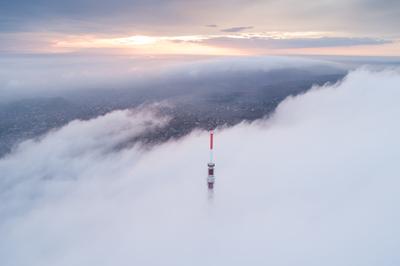 TV tower with cloudy and foggy sky-stock-photo