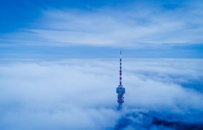 TV tower with cloudy and foggy sky-stock-foto