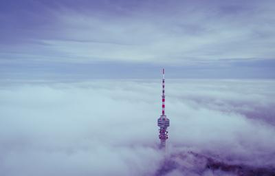 TV tower with cloudy and foggy sky-stock-foto