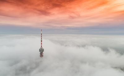 TV tower with cloudy and foggy sky-stock-foto
